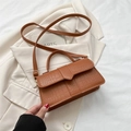 Brown crocodile embossed small square bag with shoulder strap on beige blazer - Brown
