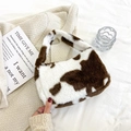 Faux fur cow print handbag with soft plush texture and silver metal zipper closure - Brown Cow Print