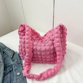 Pink popcorn texture tote bag with wide shoulder strap shown with a denim jacket - Rose Pink