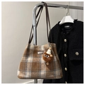 Detail of retro plaid tote bag in tweed with a cute monster plush charm on shoulder strap - Khaki With Rabbit Pendant