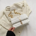 White quilted crossbody bag with gold V-shaped metal logo and fringe chain tassel - White
