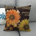 Close-up of linen sunflower pillowcase with vintage print on a light grey sofa - Summer Vintage Sunflower (4)