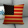 Close-up of vintage American flag linen throw pillow case on a grey fabric sofa - 18x18 Inch / Blue with Gold Stars (1)