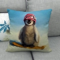 Detail of penguin skiing print on linen cushion cover showing textured fabric weave - Skiing Penguin (6)