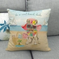 Linen pillow cover with beach dog print and 'be a real beach babe' text on grey sofa - Beach Bulldog Style (3)