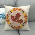 Close-up of autumn linen pillowcase with leaf wreath design on a grey sofa - 18x18 Inch / Falling Leaves Wreath Style (5)