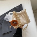 Chic cream white drawstring bucket bag with gold chain and brown plush monster charm - With Pendant / Off White