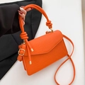 Orange textured faux snake leather crossbody bag with braided handle and gold hardware - Orange