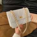 White quilted chain shoulder bag with gold twist lock and elegant crossbody strap - Off-white