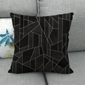 Modern black linen cushion cover with white irregular geometric patterns on a grey sofa - Black Background White Lines Geometric