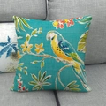 Close-up of the linen-textured fabric showing parrot and floral tropical print patterns - Teal Parrot Style (6)