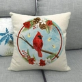 Macro detail of linen pillow cover featuring a red cardinal bird and winter pine cone patterns - Circular Cardinal With Winter Botanical Design (7)