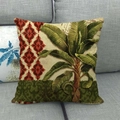 Detailed texture of green tropical banana leaf linen pillowcase on a gray sofa - Tropical Banana Leaf Geometric Patchwork (1)
