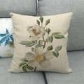 Detail of floral linen pillowcase showing vintage rose print on gray fabric sofa - White Wild Rose Pattern (Pattern 16) / 45x45cm