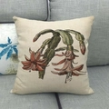 Detailed close-up of a floral linen pillowcase on a grey sofa for home decoration - Red Schlumbergera Pattern (Pattern 20) / 45x45cm