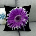 Detail of purple daisy flower print on black linen pillowcase shown on a gray sofa - 45x45cm / Purple Gradient Gerbera Style (14)