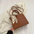 Brown quilted leather tote bag with V-pattern stitching and decorative silk scarf detail - Brown