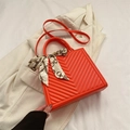 Bright orange crossbody square bag with V-shaped quilting and decorative scarf - Orange