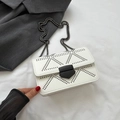 White faux leather chain crossbody bag with modern geometric rivet pattern - White
