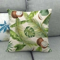 Detail of linen cushion cover showing tropical green leaves and coconut prints on sofa - 18x18 Inch / Monstera and Palm Leaves Mix (5)