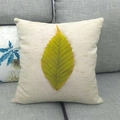 Detail of linen cushion cover with yellow-green autumn leaf print on gray sofa - Yellow-Green Broadleaf Plant (8)