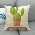 Close-up of linen cushion cover with cartoon cactus print on a grey fabric sofa - 45cmx45cm / Branched Cartoon Cactus With Label (8)