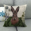 Detail of linen texture pillow cover featuring vintage rabbit print on grey fabric sofa - Vintage Newspaper Style Rabbit / 45x45cm