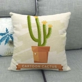 Detail of cartoon cactus print on linen pillowcase against a gray fabric sofa - 45cmx45cm / Double-headed Cartoon Cactus With Label (11)
