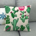 Detailed texture of linen cushion cover featuring hand-drawn cactus plants on a grey sofa - Hand-drawn Cactus Illustration Style (5)