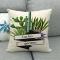 Close-up of cactus garden print on linen pillowcase placed on a grey sofa couch - Black Ribbon Garden Style (10)