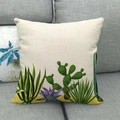 Close-up of linen pillowcase with green cactus print on a grey fabric sofa - Desert Plant Illustration Style (15)