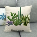 Detail of linen cushion cover showing printed cactus garden design on a grey sofa - Handwritten Script Cactus Garden Style (16)