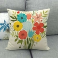 Detail of colorful floral bouquet print on textured linen pillowcase against a sofa - Sunflower and Poppy Floral (6)