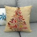 Linen Christmas pillow case with festive tree and birds on a cozy grey sofa - Robin Christmas Tree Style
