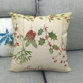 Detailed texture of linen cushion cover with Merry Christmas print and pinecone patterns - Pinecone Holly Christmas Style