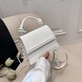 Chic white crossbody bag featuring a unique knotted handle and removable shoulder strap - White