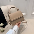 Elegant beige crossbody bag with a unique knotted handle and adjustable shoulder strap - Khaki