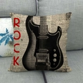 Detail of rock style cushion cover with electric guitar print and newspaper background - Rock Guitar (12)
