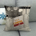 Macro detail of retro cinema theme cushion cover on sofa showing vintage film projector pattern - Vintage Cinema Ticket Style