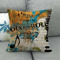 Detail of vintage rock theme pillow cover with musical instruments on a gray sofa - Rock Graffiti Style