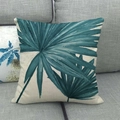 Detailed texture of linen pillowcase featuring teal palm leaves on a grey sofa - 18x18 Inch / Blue Green Palm Leaf (5)