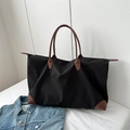 Bolso de viaje grande en nailon negro con asas de cuero marrón y cierre de cremallera - Negro