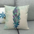 Detail of linen pillowcase featuring a colorful feather print on a gray fabric sofa - 45x45cm / Dark Blue And Purple Gradient Art Feather (8)