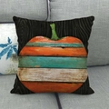 Detail of linen Halloween pillowcase with artistic colorful striped pumpkin pattern on sofa - Artistic Pumpkin Color Stripe Pattern (Style 10)
