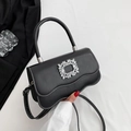 Black leather-style crossbody bag with rhinestone buckle and white contrast stitching - Black