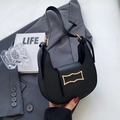 Minimalist black crescent hobo bag with a distinctive golden geometric buckle detail - Black