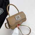 Chic khaki leather handbag featuring a wave flap and sparkling crystal buckle accent - Khaki