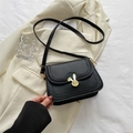 Vintage black PU leather crossbody bag with a golden rabbit head lock and wavy flap cover - Black