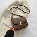 Brown vintage crossbody bag featuring a golden rabbit head twist lock and PU strap - Brown