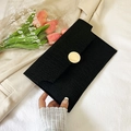 Minimalist black envelope clutch bag featuring crocodile texture and a gold metal buckle - Black